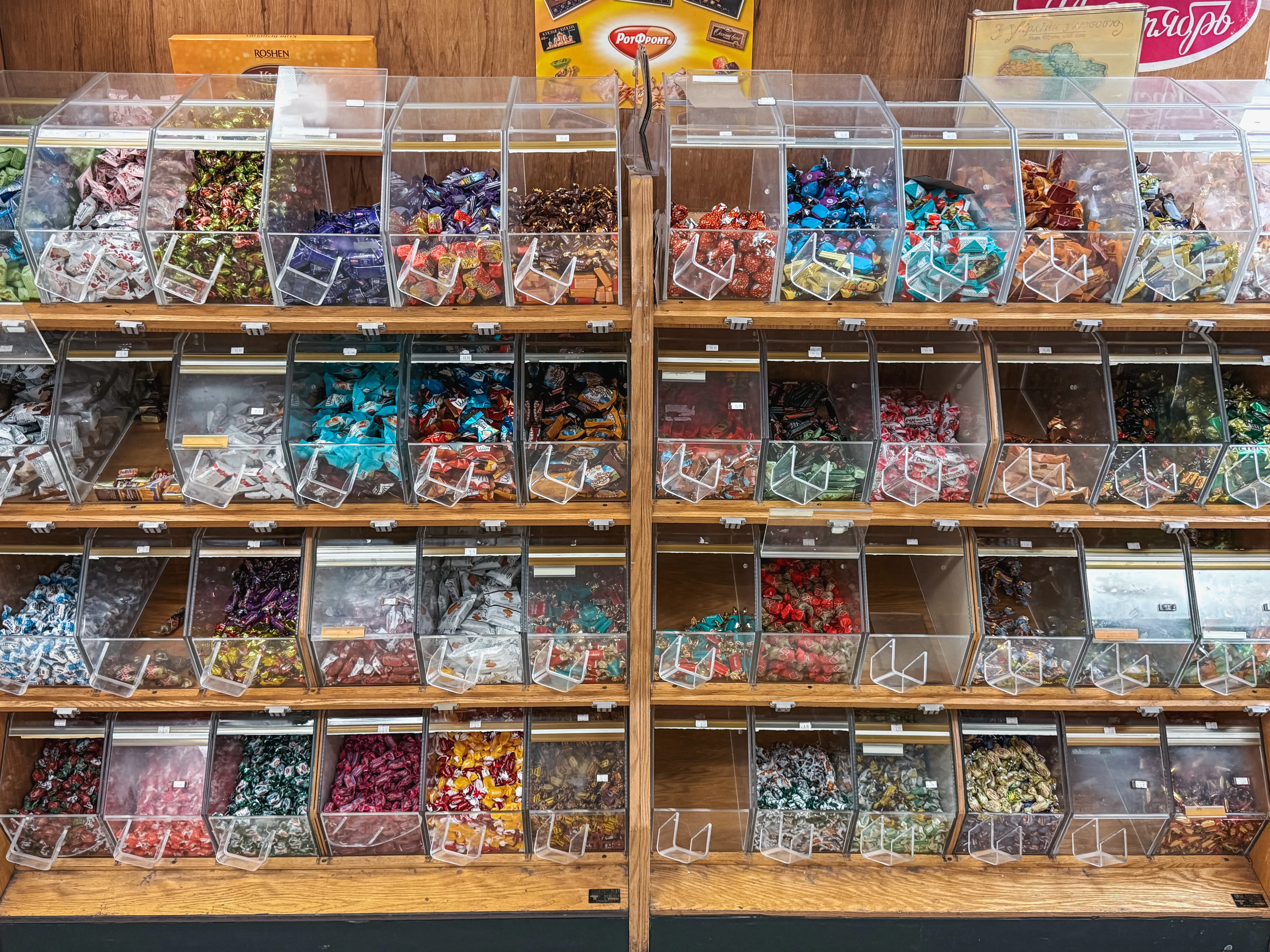 Candy bins filled with wrapped European candies at Aleksey's Market.